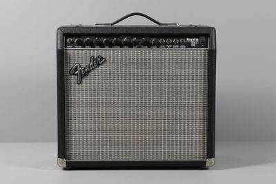 a close up of a fender guitar amplifier sitting on top of a table
