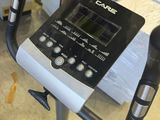 a close up of a stationary exercise bike with a monitor on it