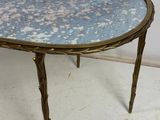 a small table with a blue glass top on it