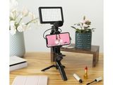 a cell phone that is on a tripod on a table