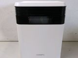a close up of a white and black air purifier on a table