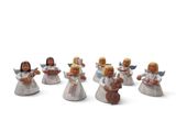 seven figurines of angels holding musical instruments