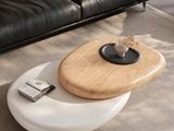 a white coffee table with a wooden top on a carpeted floor