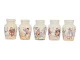 three vases with pictures of people on them sitting next to each other