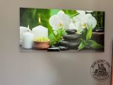 a picture of a picture of candles and flowers on the wall