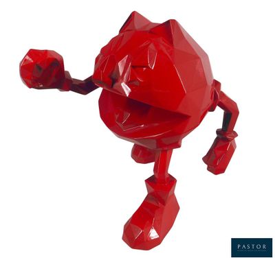 un robot rouge posé sur une surface blanche