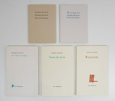 four books on a white table with a red chair in front of them