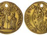 une pièce d'or sur laquelle figurent une femme et un homme