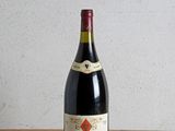 a bottle of wine sitting on a wooden table