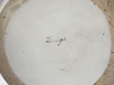 a close up of a plate with writing on it