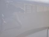 a man that is standing next to a train in the fog
