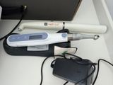 an image of a hair dryer and a charger on a table