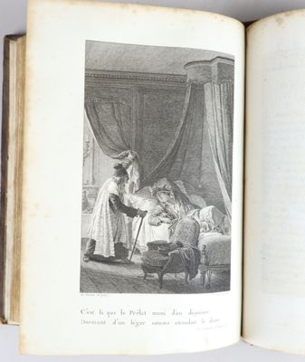un livre ouvert sur lequel figure l'image d'une femme et d'un enfant dans un lit