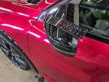 a close up of a red car with a remote control in it