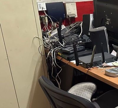 a desk with a computer and a monitor on it