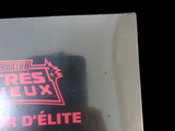 a picture of a close up of a sticker on a black background