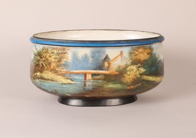 a bowl with a painting of a bridge on it