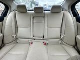 beige leather seats in the back of a car in a parking lot