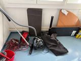 an image of a room that has a vacuum and other items on the floor