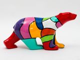 a colorful bear figurine on a white background