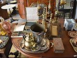 a table with a lot of antique items on it