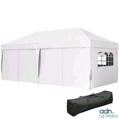 a white tent with a black bag on top of it