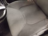 a picture of the inside of a car with the seat up