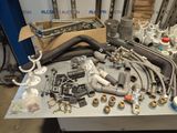 a table with a bunch of pipes and fittings on it