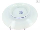 a white plate with a blue and white design on it