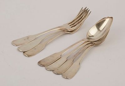 two silverware spoons and a fork on a white surface