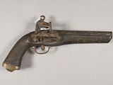 an old gun with a man on top of it
