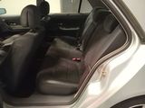the interior of a car with the door open and the seats down