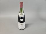 a bottle of wine that is sitting on a table