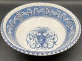 un bol bleu et blanc orné d'inscriptions en chinois