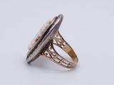 a close up of a silver ring with a stone in it