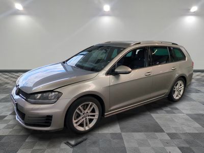 the volkswagen golf wagon is parked in a large room