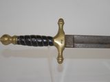 an image of a close up of a sword on a white surface