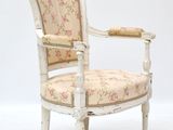 chair with floral upholstered seat and arm rest