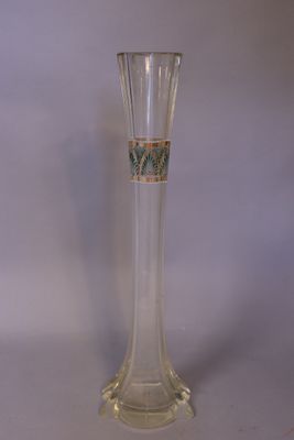 a clear glass vase with a floral design on it