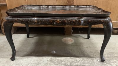 an image of a black table with a leather top and legs