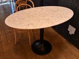 a table with a marble top and chairs in a room