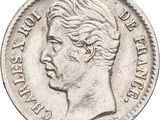 a close up of a coin with a woman ' s face on it