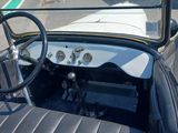 a view of a car from the driver ' s seat