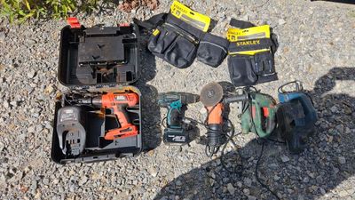 many tools that are laying out on the ground