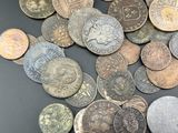 a lot of coins that are on the table