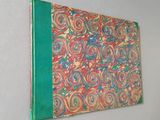 a picture of a book on a wall with a green cover