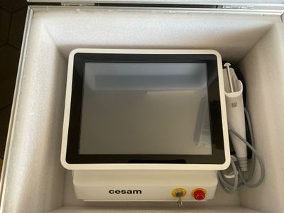 a white box with a monitor inside of it