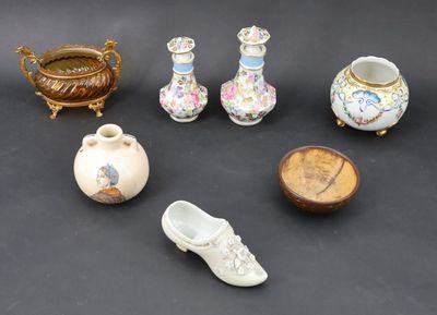 many different types of vases and other items on the table