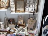 a display of jewelry on a shelf in a store