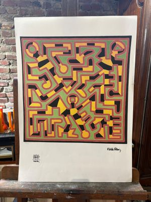 an image of a large piece of art sitting on top of a wooden table